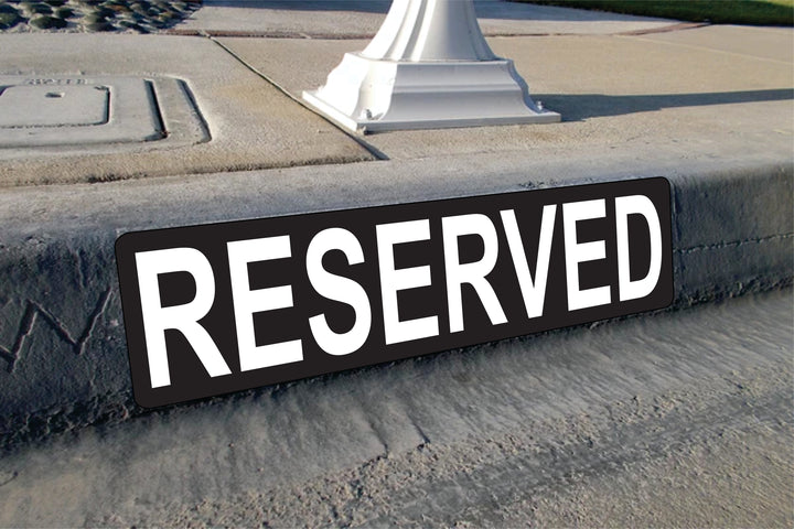 curb reserved parking signs